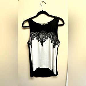 Black and white sleeveless blouse (Size M)